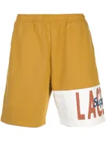 Supreme Lacoste Logo Panel Track Shorts In Gold