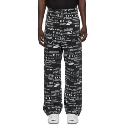 Balenciaga All Over Print Baggy Cotton Denim Jeans In Black