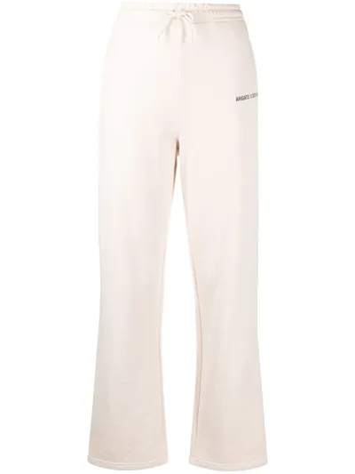 Axel Arigato Logo-print Organic Cotton Flared Track Pants In Beige