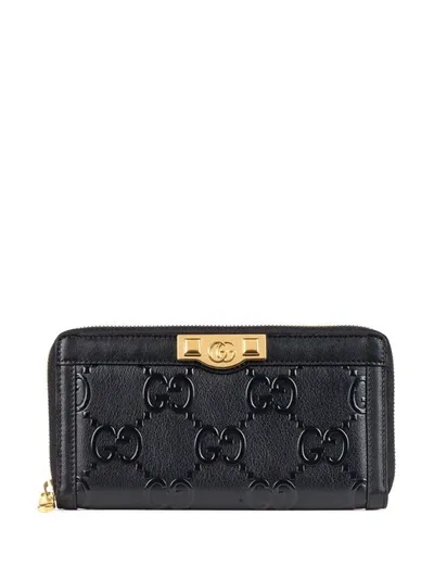 Gucci Gg Embossed Zip Around Wallet In Black