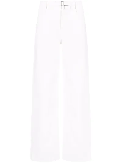 Jil Sander Washed Cotton Denim Flared Jeans In Beige