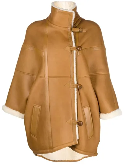 Saint Laurent Oversized Leather Cape With Shearling Lining In Bourbon Ecru