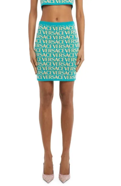 Versace Allover Logo-print Knitted Skirt In Turquoise