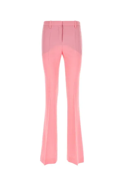 Versace Wool Flared Allover Logo Pants In Pink