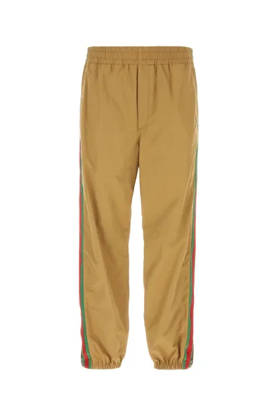 Gucci Logo Embroidered Tapered Pants In Brown