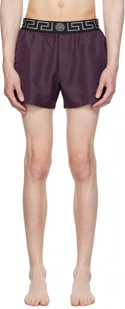 Versace Greca Logo Waistband Swim Shorts In Purple