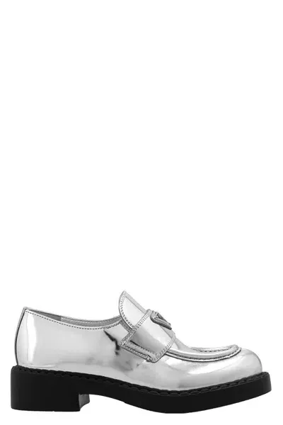 Prada Metallic Leather Logo Loafers In Argento