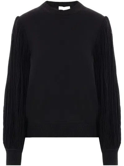 Alaïa Fringed Sleeve Jumper For Women In Black