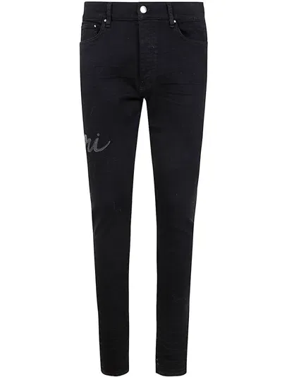 Amiri Script Distressed Skinny Jeans In Black