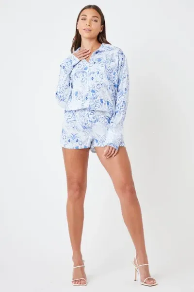 Creea The Label Button-up Long Sleeve Print Romper In Blue