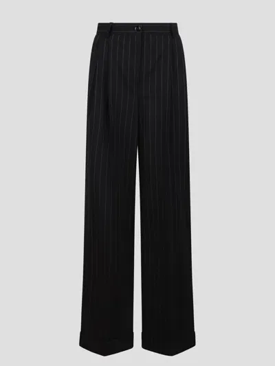 Dolce & Gabbana Pinstriped Trousers In Black