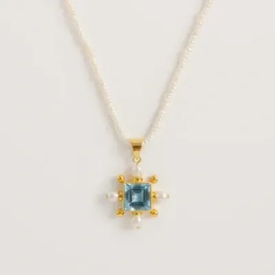 Freya Rose Seed Pearl Necklace With Blue Topaz Cross Pendant In Ivory