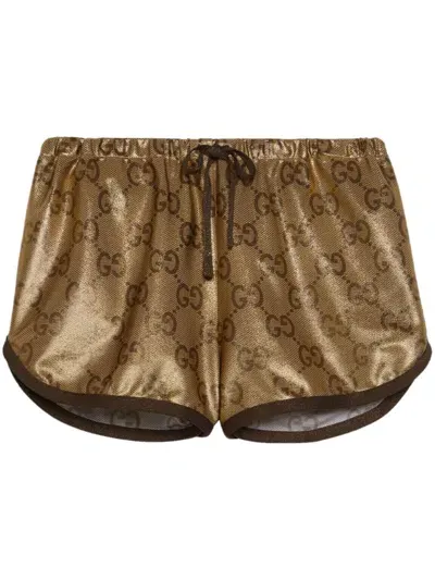 Gucci Metallic Monogram Drawstring Shorts In Gold