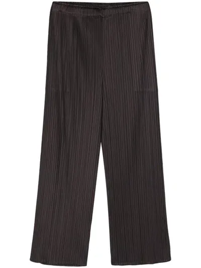 Issey Miyake Pleated Satined Cropped Trousers In Nero