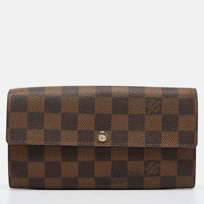 Pre-owned Louis Vuitton Damier Ebene Canvas Sarah Wallet In Brown