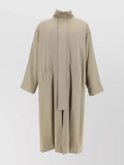 Magliano Belted High Collar Long Coat In Beige