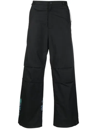 Maharishi Graphic-print Trousers In Black