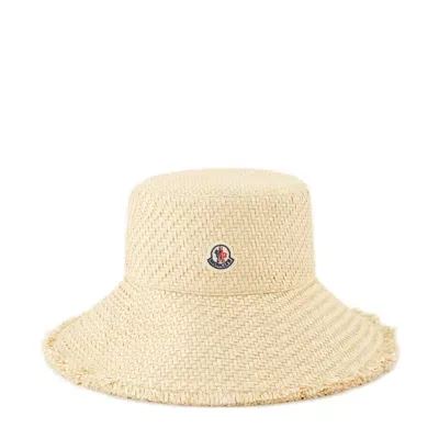 Moncler Logo Patch Fringed Interwoven Hat In Beige