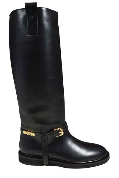 Moschino Logo Plaque Buckle Detailed Boots In Black