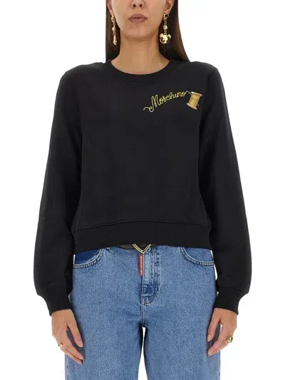 Moschino Logo Printed Crewneck Sweatshirt In Black