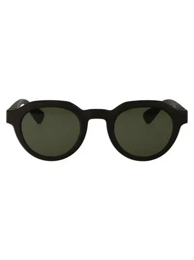 Mykita Sunglasses In 355 Md22-ebony Brown Green Solid