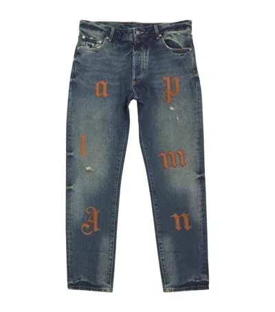 Palm Angels Logo Patch Jeans In Multicolor