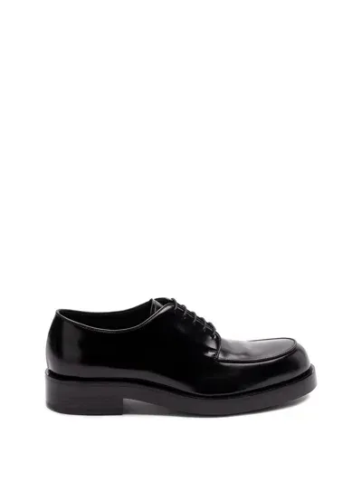 Prada Brushed Leather Derby Shoes In Black  