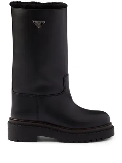 Prada Shearling Leather Boots In Black