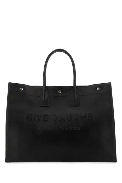 Saint Laurent Handbags. In Black