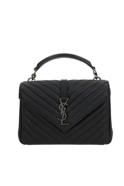 Saint Laurent Handbags. In Black