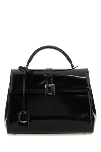 Saint Laurent Handbags. In Black