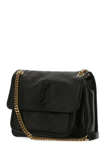 Saint Laurent Handbags. In Black