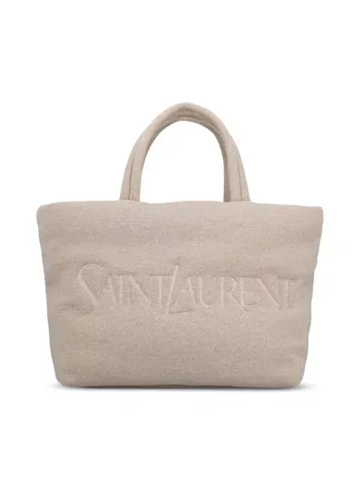 Saint Laurent Logo Debossed Top Handle Bag In Beige