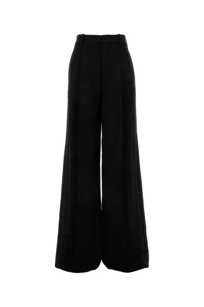 Saint Laurent Pleated Wool Slim-leg Pants In Black