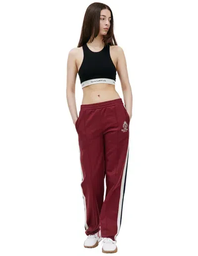 Sporty And Rich Crown Track Pants In Merlot