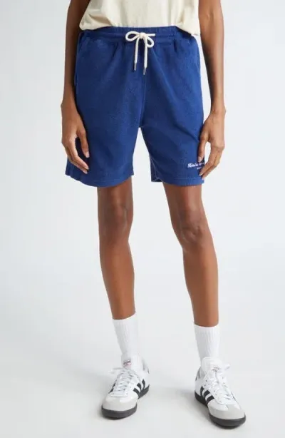 Sporty And Rich Sporty & Rich Hotel Du Cap Cursive Terry Cloth Shorts In Indigo