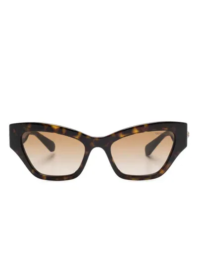 Swarovski Sonnenbrille Mit Cat-eye-gestell In Braun