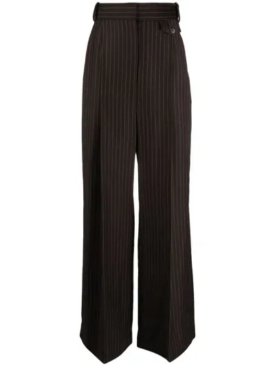 The Mannei Pinstripe Flared Wool Trousers In Brown