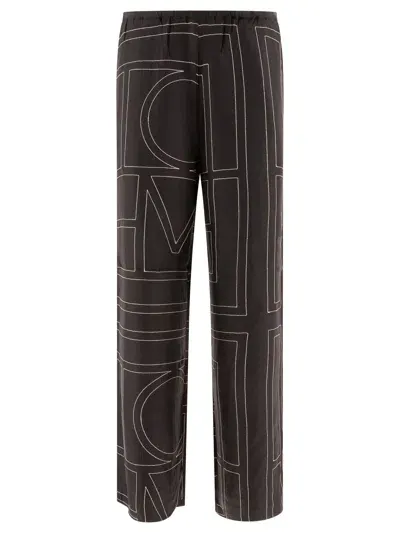 Totême Monogram Trousers In Black