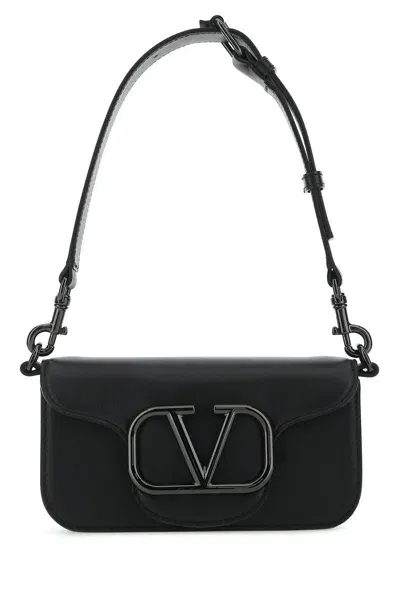 Valentino Garavani Handbags. In Black