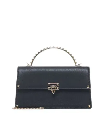 Valentino Garavani Handbags. In Black