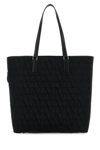 Valentino Garavani Handbags. In Black