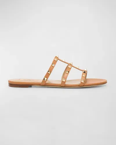 Valentino Garavani Rockstud Caged Flat Slide Sandals In Kel Almond Beige