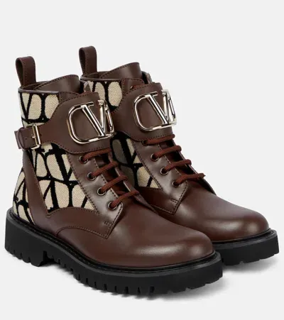 Valentino Garavani Logo-embossed Leather Combat Boots In Brown