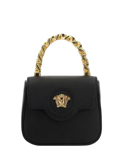 Versace Handbags. In Black