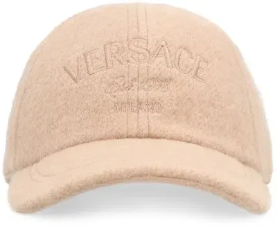 Versace Logo Embroidered Baseball Cap In Beige