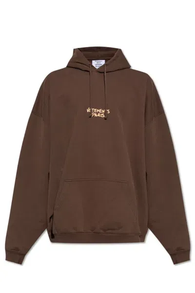 Vetements Logo Printed Drawstring Hoodie In Brown