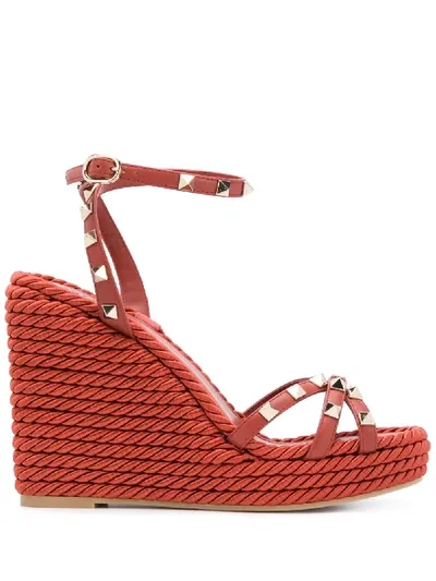 Valentino Garavani Rockstud Cowhide Ankle Strap Wedge Sandal In Red