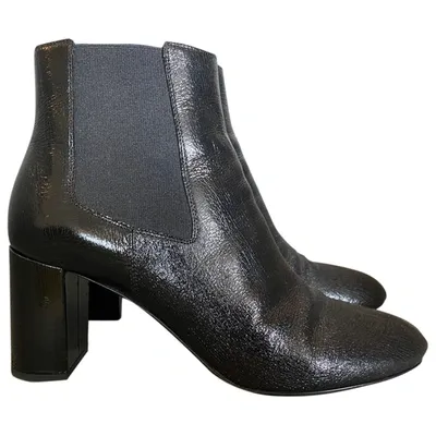 Pre-owned Saint Laurent Patent Leather Boots In Black