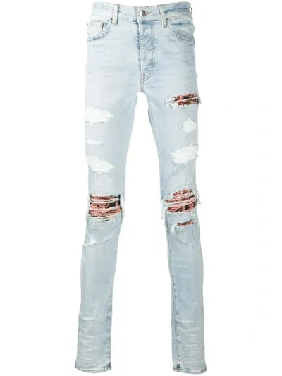 Amiri Distressed Skinny Jeans In Blue